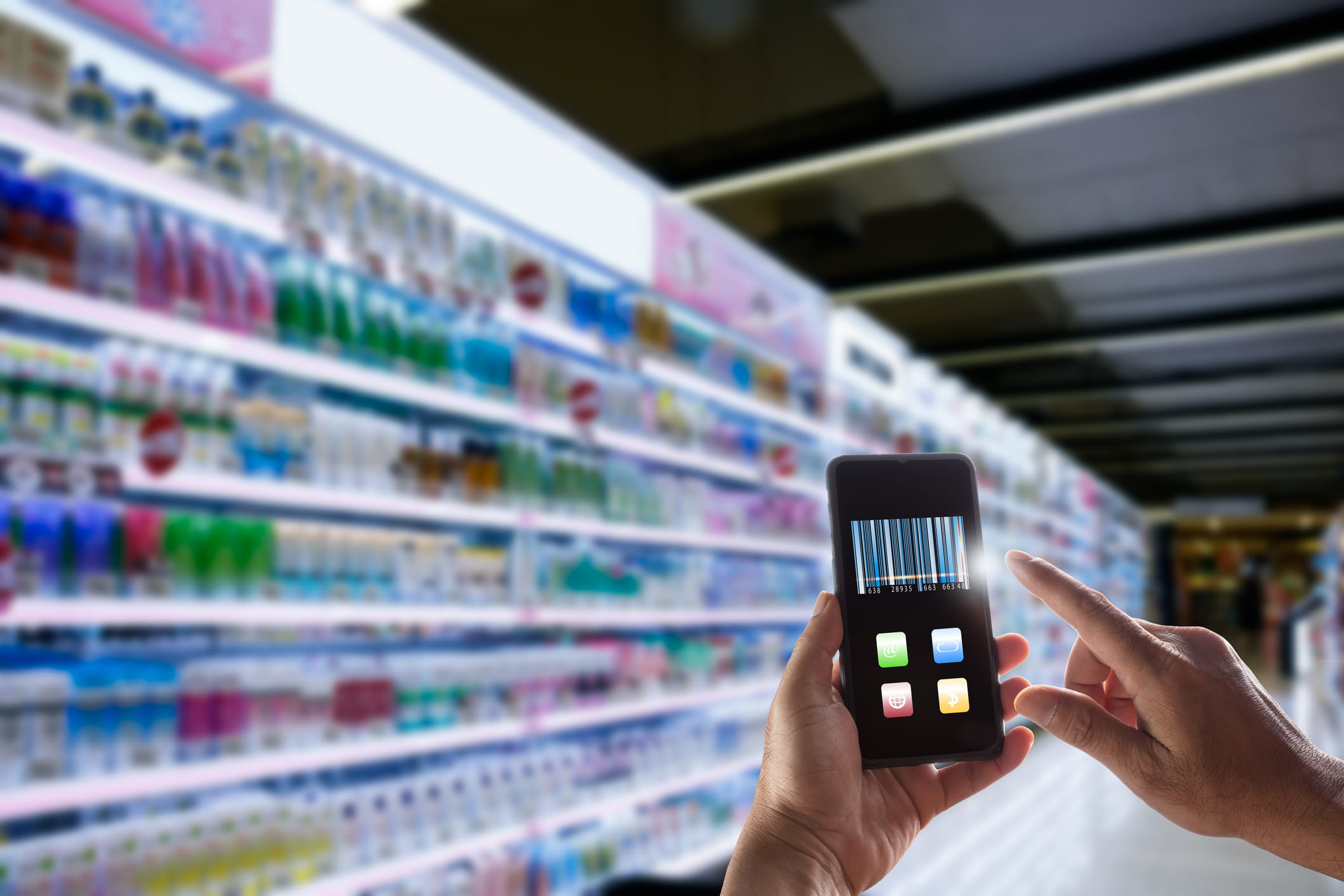 consumer scanning products on smartphone in store