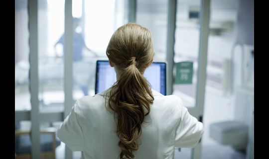 provider at computer from back