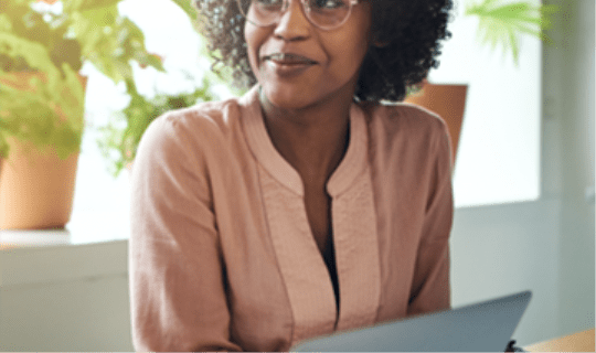 Lady sitting at a desk with a laptop