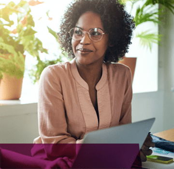 Lady sitting at a desk with a laptop